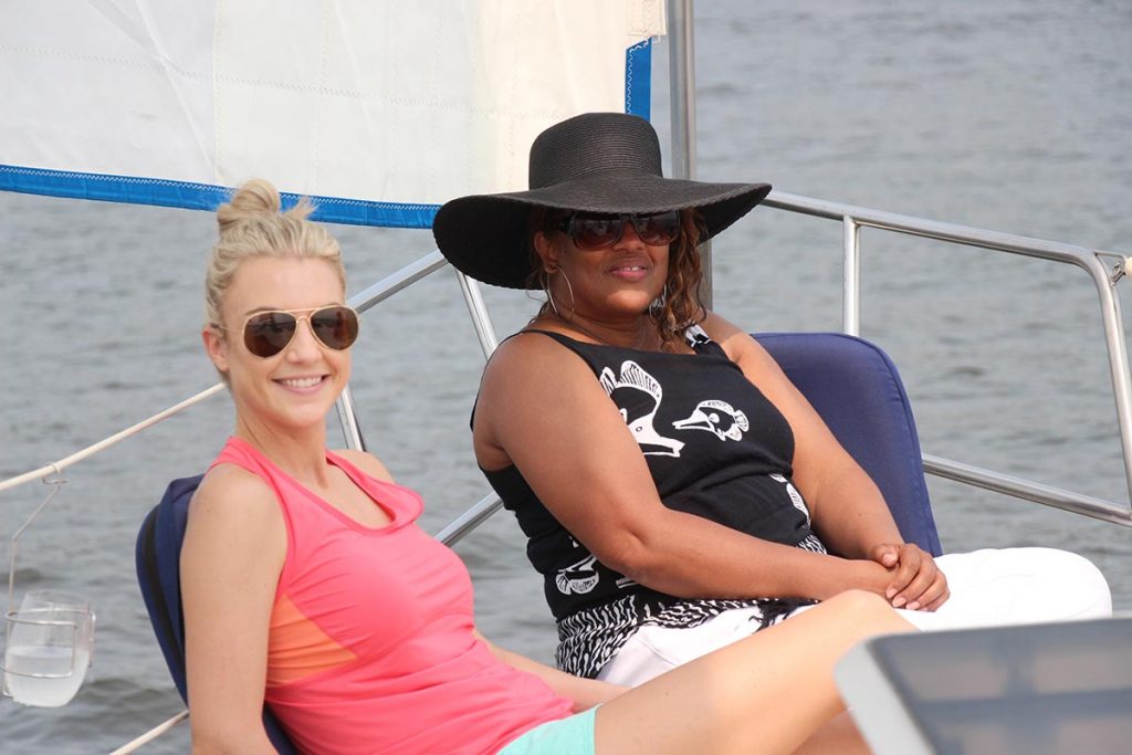 two women on a sailboat on lake pepin