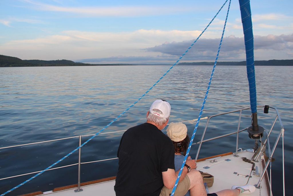 A couple enjoying an evening sailing charter