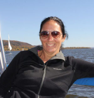 woman enjoying sailboat ride on lake pepin in minnesota