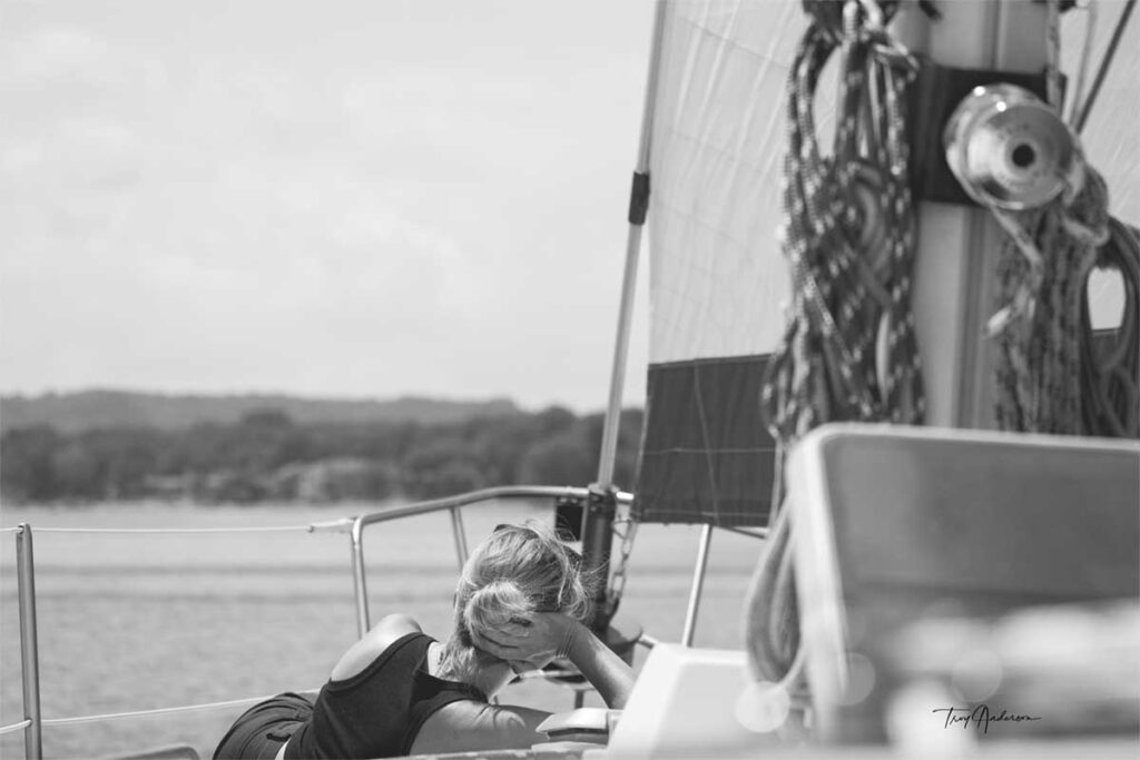 A woman enjoying sailing at the bow